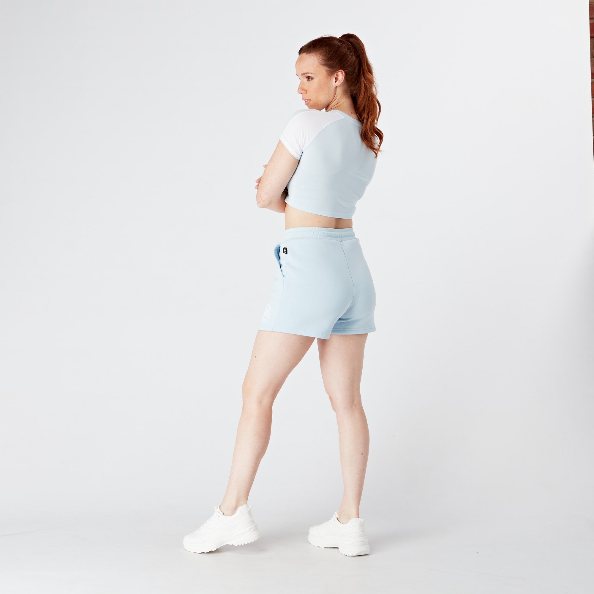 light-blue-iris-and-white-crop-branded-tee-full-body-back