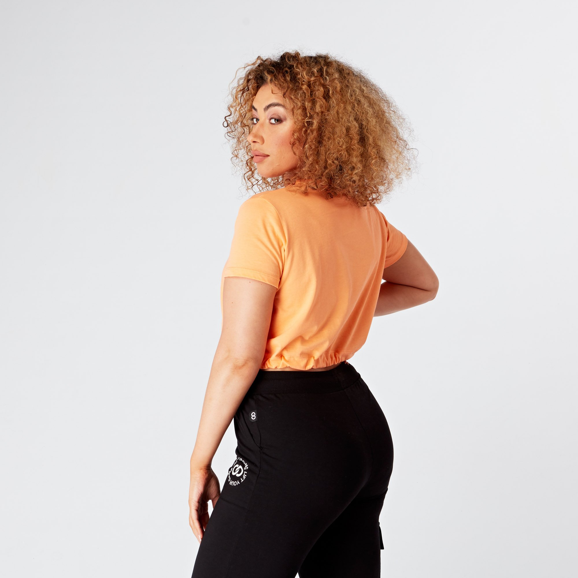 peach-sorbet-cropped-stamp-graphic-tee-model-back